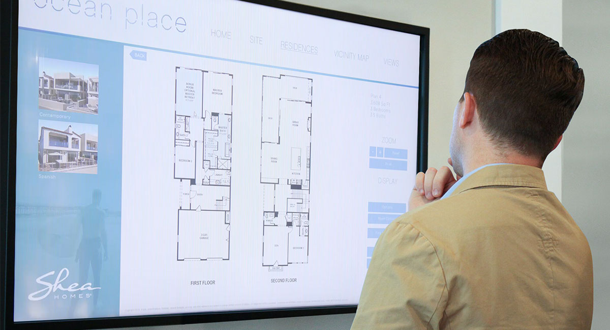 Potential home buyer exploring floor plans on the next™ app
